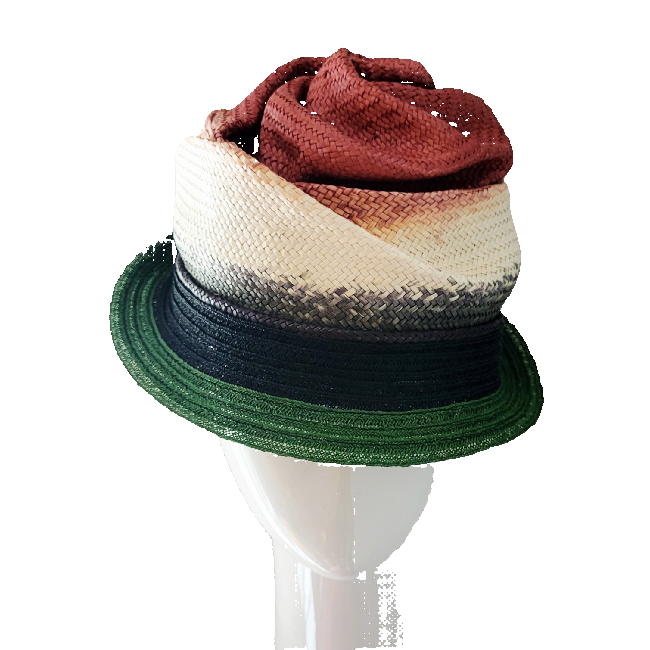 Multicolored straw hat on a mannequin head against a plain background